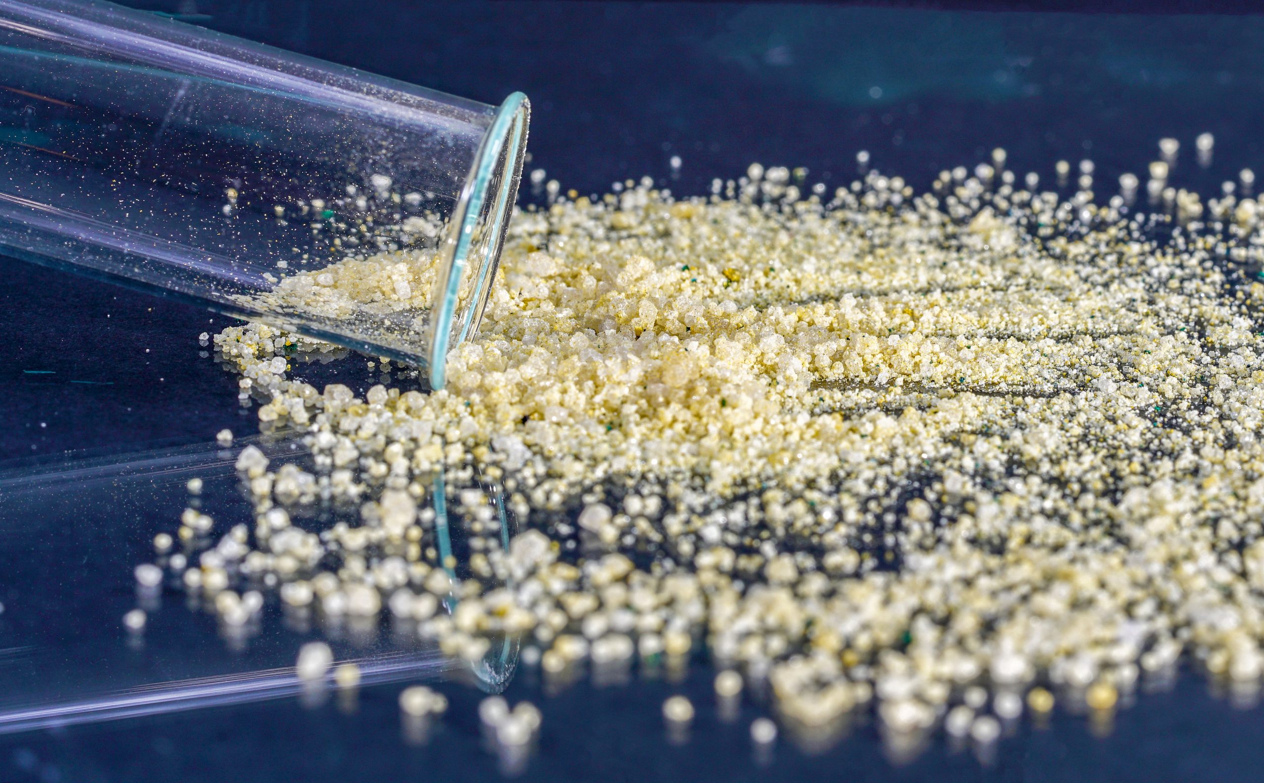 Spilled granules of ammonium sulfate, a byproduct of the eco-efficient WFGD process, representing a sustainable solution in reducing emissions without producing CO2.